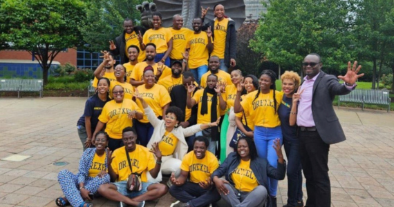Image of the 2023 Mandela Washington Fellowship Cohort at the Mario the Dragon statue on Main Campus.